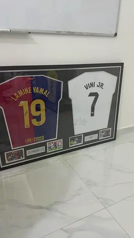 Framed Laminé Yamal and Vini Jr. Signed Football Jerseys Display
