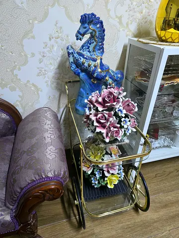 Vintage brass tea/serving trolley with decorative ceramic flowers