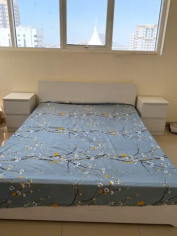 Queen bed frame with mattress and matching bedside tables
