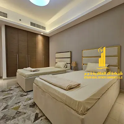 Luxurious and elegant two-bedroom apartment with a living room, fully furnished with brand new, high-end furniture, in a prime location with a gym, sw