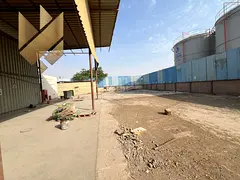 Industrial Yard for Rent in Al Saja’a | 20,000 Sq. Ft. | 6 Workers’ Rooms | 70 kW Power Supply |