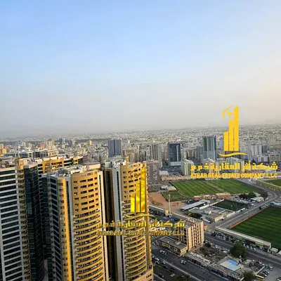 Two bedrooms and a living room with a sea view, fully furnished with new furniture, available for monthly rent in Ajman - Al Rashidiya 1 - Oasis Tower