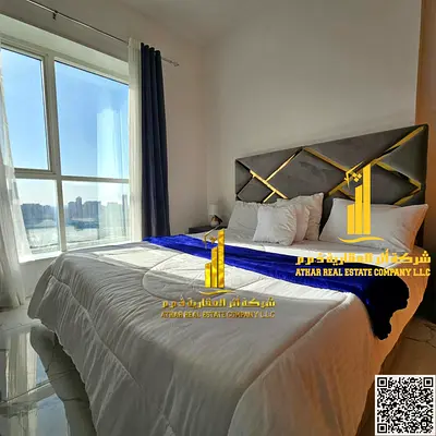 The most beautiful furnished two-bedroom apartment for monthly rent with a gym, swimming pool and parking in Ajman - Al Rashidiya - Al Waha Towers