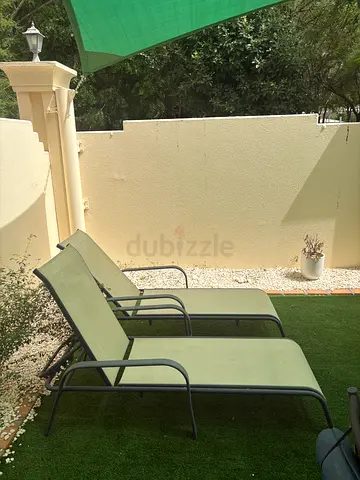 Pair of outdoor reclining sun loungers