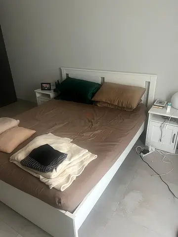 White wooden single/double bed frame with built-in headboard shelves - good condition