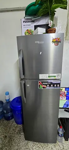 Used double-door stainless steel refrigerator - good condition
