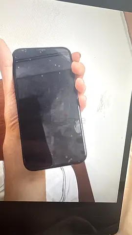 Used iPhone with screen smudges - good condition, unlocked