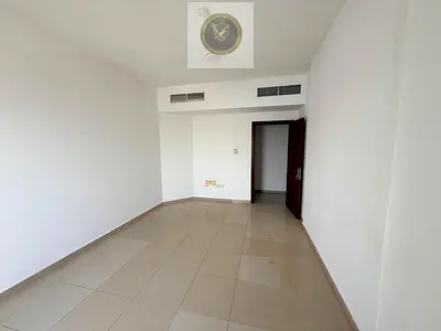 Beautiful 2-bedroom apartment with living room in Sharjah – free parking, central AC, balcony with open view, prime location on Dubai exit.