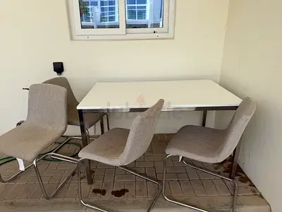 White Dining Table with 4 Grey Upholstered Chairs - Good Condition