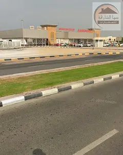For sale, land in the Al-Yash area, Wasit suburb, Sharjah, on a main street, a very, very special lo