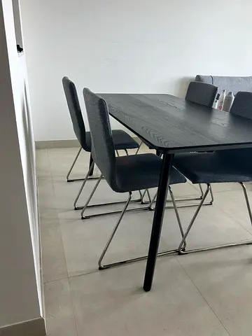 Modern black dining table with 4 grey upholstered chairs - set