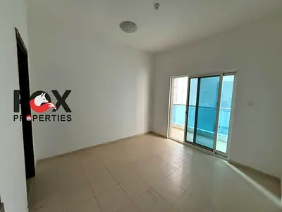 1BHK for annual rent in City Tower, Al Nuaimiya 3, Ajman. 2 bathrooms, balcony with Sharjah view and free parking. Rent AED 30,000.