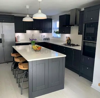 Modern dark-gray kitchen with large central island and breakfast bar