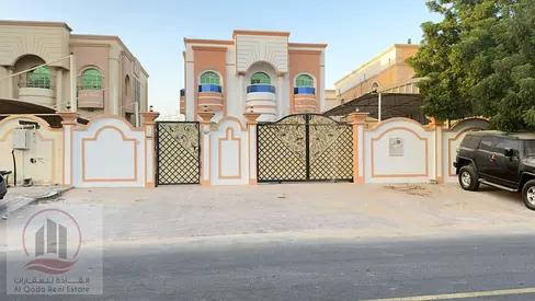For sale, a villa in Ajman Al Rawda, 5 master rooms, a Majles room, a hall, maid room, freehold for all nationalities, Installment with out