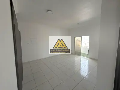 شقة غرفة وصالة مع بلكونة وخزائن حائط للإيجار السنوي في الراشدية 3 عجمان مقابل أبراج عجمان ون مباشرة