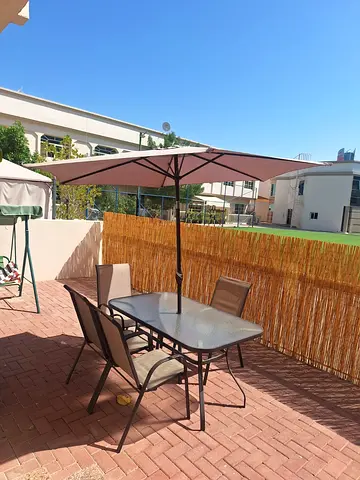 Outdoor patio dining set with umbrella — 4 chairs, glass table