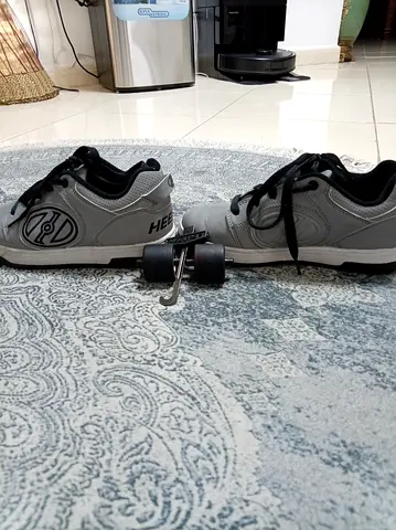 Gray Heelys roller shoes with removable wheels, size available