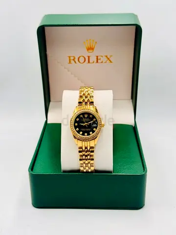 Rolex gold ladies wristwatch with black dial, in original box