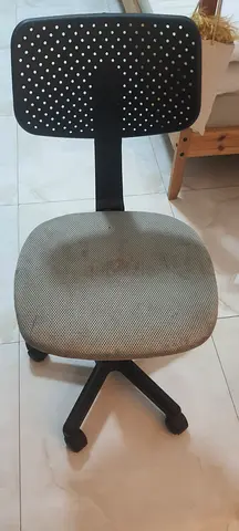 Used ergonomic office swivel chair with fabric seat