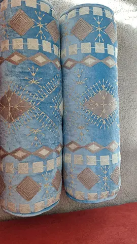 Pair of patterned light blue bolsters/sofa cushions - immaculate condition.