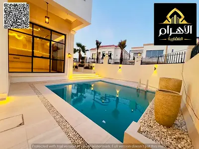Luxury villa on a corner lot overlooking Al Hamidiya Park, with a private garden and pool – high-end finishes, price includes electricity, water, air