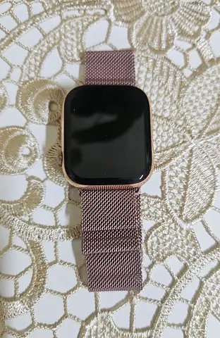 Rose-gold smart watch with metal mesh strap — perfect condition for ladies