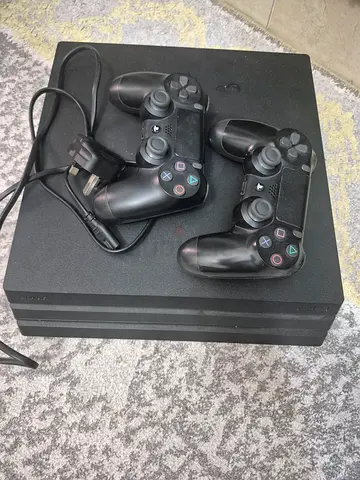 PlayStation 4 Slim with 2 Controllers - Good Working Condition