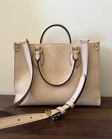 AUTHENTIC Louis Vuitton on the go Beige genuine Leather Top-Handle Shoulder Bag