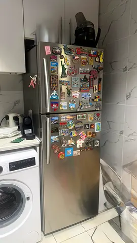 Silver Top-Freezer Refrigerator in Good Working Condition - 2-Door