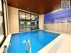 Modern villa with an indoor pool next to a garden, price includes fees, electricity, water, and air