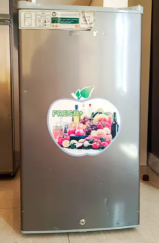 Single-door compact refrigerator in silver - good condition