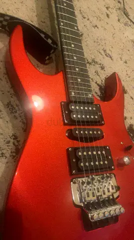 Red Electric Guitar with Double Humbucker and Tremolo — Good Condition