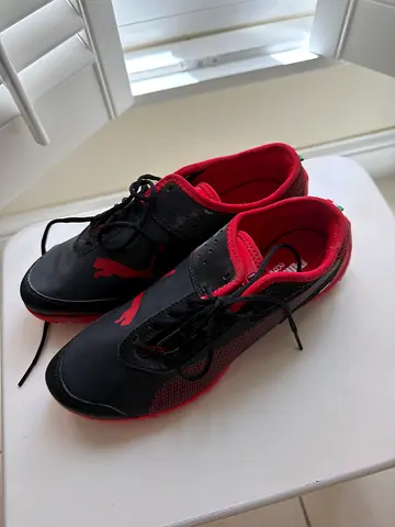 Puma mens black and red athletic sneakers, gently used