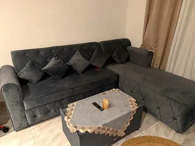 Grey L-shaped Velvet Sofa with Ottoman - Good Condition