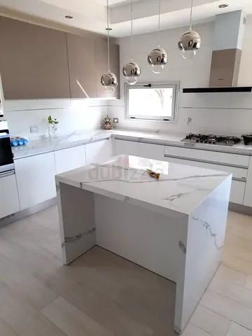 Contemporary Kitchen Island with Stone Cladding and Elegant Architectural Design