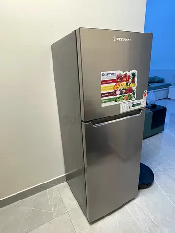 Silver double-door refrigerator with freezer - good condition