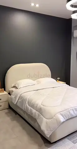White upholstered double bed with headboard - good condition