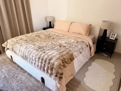 Used Double Bed with Faux Sheepskin Throw and Nightstands - Good Condition