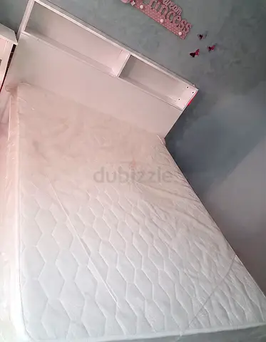 White twin bed with built-in headboard shelves , 3 inbuilt drawers big, mattress.contact 0561303769
