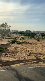 Residential land for sale in Al-Hawshi area, new development. Area: 2745 sq ft. Corner plot, second