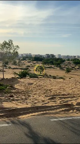 Residential land for sale in Al-Hawshi area, new development. Area: 2745 sq ft. Corner plot, second plot from a main street,