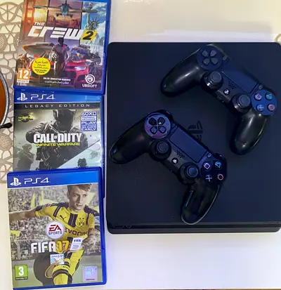 Sony PlayStation 4 Slim with 2 Controllers and 3 Games