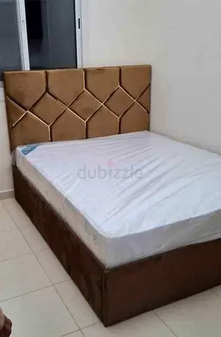 Brand New Queen size bed with upholstered storage base and padded headboard