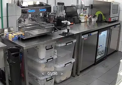 Commercial stainless steel cafe prep counter with under counter fridge, freezer and bar cooler.