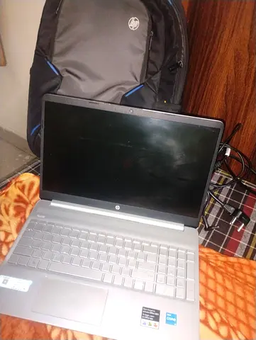 HP 15-inch Laptop with Charger and Backpack - Good Condition