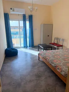 Bright  Spacious Room with big Balcony  Separate Washroom| Prime Karama Location- Fully Furnished