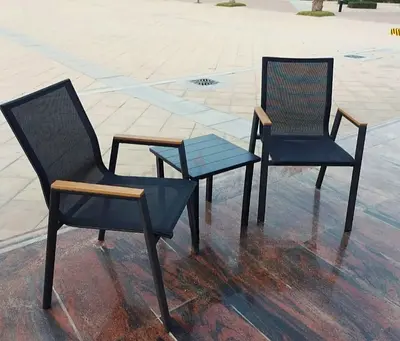 Outdoor patio set — 2 mesh chairs with small side table (used)