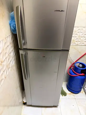 Used double-door refrigerator, stainless steel finish - working condition