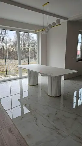 Modern Minimalist Dining Table with Organic Form and Architectural Design