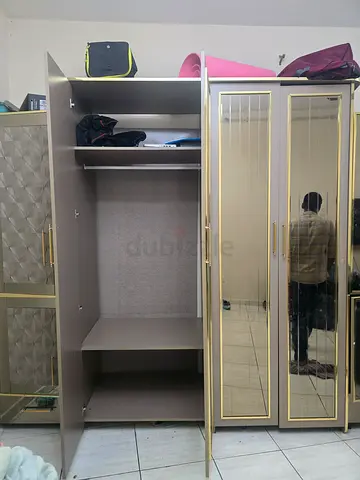 7 door mirrored wardrobe with gold trim good condition.